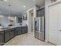 Modern kitchen with grey cabinets, stainless steel appliances, and granite countertops at 2525 W Balao Dr, Phoenix, AZ 85085