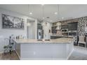 Spacious kitchen features granite counters, mosaic backsplash and stainless steel appliances at 2525 W Balao Dr, Phoenix, AZ 85085