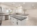 Kitchen featuring white cabinetry, stainless appliances, gray countertop, and large island at 25450 W Pueblo Ave, Buckeye, AZ 85326