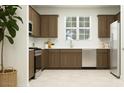 Well-lit kitchen featuring stainless steel appliances and shaker cabinets at 2944 N 98Th Ln, Phoenix, AZ 85037
