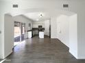 Bright kitchen with an island, stainless steel appliances, and a sliding door to the backyard at 4005 W Carter Rd, Phoenix, AZ 85041