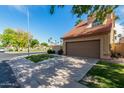 Charming home exterior with desert landscaping, long driveway, and a two-car garage at 4653 W Dublin St, Chandler, AZ 85226