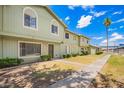 Inviting exterior view showcasing the townhome's landscape and curb appeal under a clear sky at 4743 N 26Th Ln, Phoenix, AZ 85017