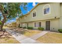 Attractive townhome complex featuring tidy landscaping and a pedestrian-friendly walkway at 4743 N 26Th Ln, Phoenix, AZ 85017