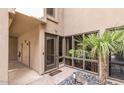 Charming front entrance with a palm tree and gravel surrounding the landscaping at 5621 N 79Th St, Scottsdale, AZ 85250