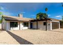 Well-maintained home with xeriscaped yard, covered entryway, and two car garage at 7125 N 23Rd Ave, Phoenix, AZ 85021
