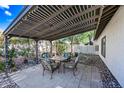 Outdoor space featuring a cozy pergola with seating, perfect for relaxation and entertaining at 7949 W Pershing Ave, Peoria, AZ 85381