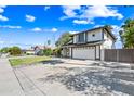 Charming two-story house features a well-kept yard and an attached two-car garage at 7949 W Pershing Ave, Peoria, AZ 85381