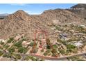 Breathtaking aerial view of estate, surrounded by desert landscape in a community with nearby amenities at 8031 N 54Th St, Paradise Valley, AZ 85253