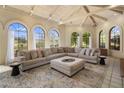 Bright living room features high ceilings, ample natural light from large windows, and a comfortable sectional sofa at 8031 N 54Th St, Paradise Valley, AZ 85253