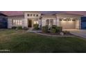 Charming single-Gathering home featuring a well-manicured lawn and a two-car garage at 8544 W Mary Ann Dr, Peoria, AZ 85382