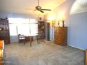 Bedroom featuring a large window, bookcase, and light blue walls at 9203 W Behrend Dr, Peoria, AZ 85382