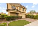 Charming two-story home featuring a two-car garage, well-maintained landscaping, and a welcoming entrance at 9911 E Telemetry Dr, Mesa, AZ 85212