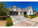 Lovely new construction home with a two-car garage surrounded by vibrant landscaping at 10156 E Talon Ave, Mesa, AZ 85212
