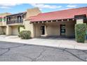 Inviting townhome exterior with covered parking and well-maintained desert landscaping at 10235 N 31St St # 15, Phoenix, AZ 85028