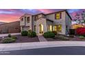 Beautiful two-story home featuring an arched entryway, desert landscaping and a two car garage at 11844 W Nadine Way, Peoria, AZ 85383