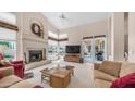 Inviting living room boasts a fireplace, high ceilings, neutral colors, and sliding door access to the patio at 14033 S 31St St, Phoenix, AZ 85048