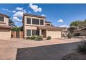 Charming two-story townhome with a two-car garage and appealing desert landscaping at 15550 N Frank Lloyd Wright Blvd # 1101, Scottsdale, AZ 85260