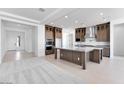 A spacious kitchen boasts stainless steel appliances, granite countertops, and ample cabinet space at 18883 E Celtic Manor Dr, Queen Creek, AZ 85142