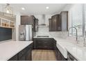 Well-lit kitchen with stainless steel appliances, white countertops, and subway tile backsplash at 22023 N 28Th Pl, Phoenix, AZ 85050