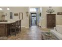 Welcoming foyer with tile flooring, and a view through to the front door at 2917 E Northridge St, Mesa, AZ 85213