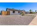 Stylish single-story home with gravel landscaping, modern walkway, and a well-maintained yard at 2926 E Corrine Dr, Phoenix, AZ 85032