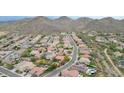 An aerial view of a community nestled in the mountains, with a highlighted property at 29506 N 21St Ave, Phoenix, AZ 85085