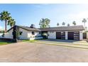 Modern single-story home with well-kept lawn and contemporary design, with spacious driveway at 3502 N Rose Circle Dr, Scottsdale, AZ 85251