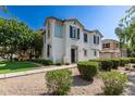 Charming two-story home featuring a stucco exterior, decorative shutters, and a tile roof at 4243 E Jasper Dr, Gilbert, AZ 85296