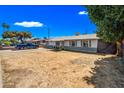 Charming single-story home with a well-maintained yard and a cozy, inviting front porch at 4828 N 71St Ave, Phoenix, AZ 85033