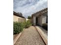 Close up of front entry walkway and garden at 7922 W Alex Ave, Peoria, AZ 85382