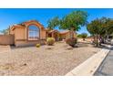 Single-story home with desert landscaping, complemented by a neutral color palette at 975 E Lincolnwood Cir, Casa Grande, AZ 85194