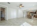 Open-concept living and dining area with tile flooring, recessed lighting, and abundant natural light at 10609 E Durant Dr, Mesa, AZ 85212