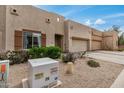 Charming home featuring an attached two-car garage and low maintenance desert landscaping at 1650 S Crismon Rd # 13, Mesa, AZ 85209