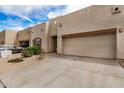 Charming home featuring an attached two-car garage and low maintenance desert landscaping at 1650 S Crismon Rd # 13, Mesa, AZ 85209