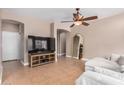 Living room with tile flooring, ceiling fan, and neutral wall colors at 1650 S Crismon Rd # 13, Mesa, AZ 85209