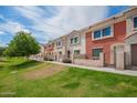 Beautiful townhouse complex with well-maintained landscaping, perfect for outdoor enjoyment at 1950 N Center St # 115, Mesa, AZ 85201
