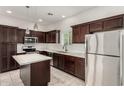 Modern kitchen with stainless appliances, center island, and plenty of storage at 2000 N 36Th St # 29, Phoenix, AZ 85008