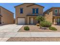 Two-story home featuring neutral paint, a driveway, and a low maintenance gravel yard at 255 W Dewey Ave, Coolidge, AZ 85128