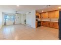 Open-concept living area with tile flooring seamlessly connecting to the kitchen space at 2625 N 40Th Dr, Phoenix, AZ 85009