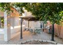 Cozy outdoor dining area with a gazebo, a patio, a grill, and lush greenery at 288 W Los Alamos St, Gilbert, AZ 85233