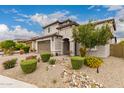 Two story home with desert landscaping, two car garage, and tile roof at 28931 N 64Th Dr, Phoenix, AZ 85083