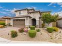 Charming two-story home boasting beautiful desert landscaping, a tile roof, and a two-car garage at 28931 N 64Th Dr, Phoenix, AZ 85083