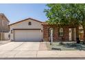 Charming single-story home with stucco and stone accents, tile roof, and a well-manicured front yard at 36197 W Cartegna Ln, Maricopa, AZ 85138