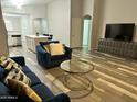 Open living room with kitchen view, stylish furnishings, and contemporary decor at 6920 S 46Th Dr, Laveen, AZ 85339