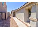 View of the front entrance of a house with a screen door and a small window to the side at 809 W Kingman Dr, Casa Grande, AZ 85122