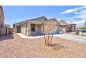 Charming single-story home with desert landscaping and a two-car garage at 809 W Kingman Dr, Casa Grande, AZ 85122