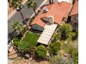Backyard space featuring a well-maintained lawn, trees, and plants, perfect for outdoor entertaining at 936 E Gila Ln, Chandler, AZ 85225