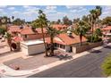 Attractive home featuring a red tile roof, desert landscaping, an attached garage, and easy street access at 936 E Gila Ln, Chandler, AZ 85225