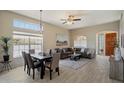 Bright living space featuring dining area, comfortable seating, and large windows at 11650 W Pincushion Ct, Surprise, AZ 85378